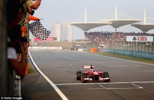 Alonso takes the chequered flag