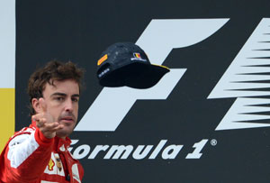 A less than delighted looking Fernando Alonso on the podium in Belgium